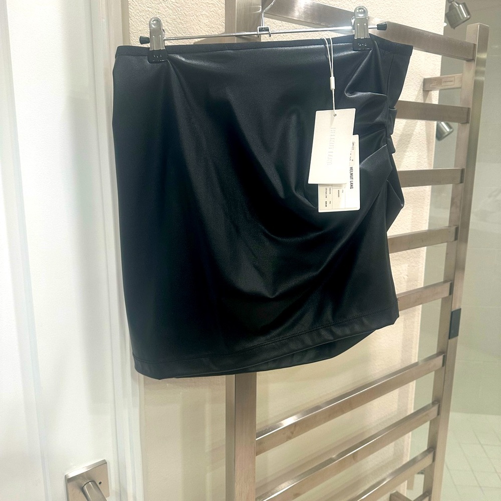 Black faux leather skirt . Never worn .